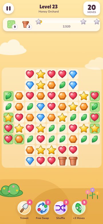 The Sugarbloom game on a phone, a match three board of hearts, stars, gems and leaves